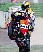 Valentino Rossi showboats for the Valencia crowd