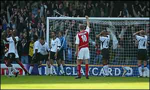 Dennis Bergkamp celebrates after Marlet's own goal