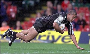 Francis Meli of New Zealand goes over to score his third try against Wales