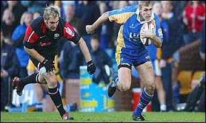 Chris Hall sprints clear of the Saracens defence on the way to scoring for Leeds