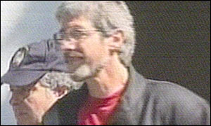 Leonardo Bertulazzi is being led away by the police