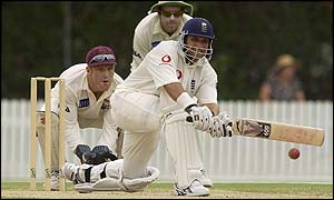 Mark Butcher sweeps the ball away as he scores freely in the morning session