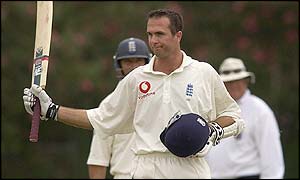 Vaughan raises his bat after reaching his hundred