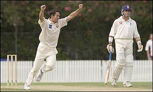 Queensland's Lee Carseldine celebrates the wicket of Andrew Flintoff who manages just three on his return from injury