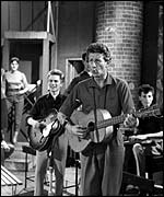 Jon Pertwee trying his hand at Skiffle. Adam Faith is on the left with guitar. From BBC show Six Five Special