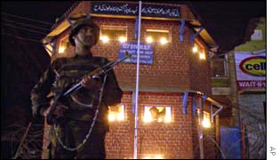 An Indian paramilitary soldier stands guard during Diwali in Srinagar