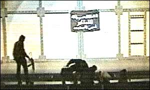 Gunmen force the orchestra out of the pit