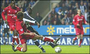 Newcastle striker Shola Ameobi fires his side ahead against Middlesbrough