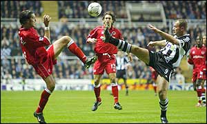 Boro full-back Franck Queudrue and Newcastle striker Alan Shearer contest a high ball