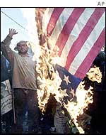 Iranians burn a US flag