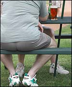 A man sitting outside a pub