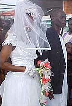 Bride wearing mosquito net dress