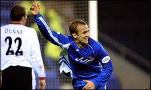 Wigan's Neil Roberts celebrates his goal against Manchester City