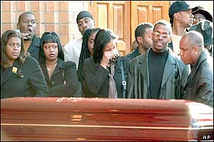 Mourners gather at the entrance of the Allen Cathedral in Queens for the funeral