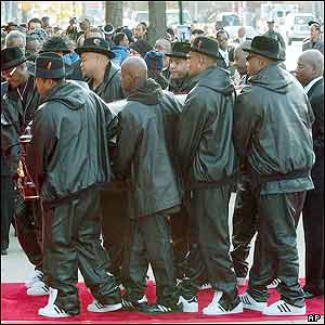 Pallbearers carrying the casket of Jam Master Jay