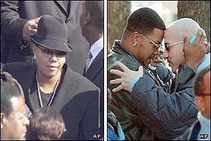 Rap singer Queen Latifah (left) and two mourners embrace head-to-head before entering the cathedral