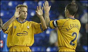 USA international Eddie Lewis celebrates his goal with team-mate Graham Alexander