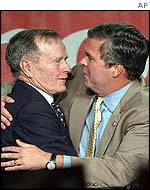 Governor Jeb Bush (right) embraces George Bush Senior