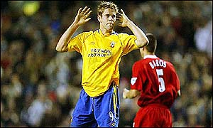 Beattie shows his despair as Liverpool show their class