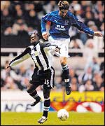 Newcastle United's Olivier Bernard battles for possession of the ball with Everton's Alessandro Pistone 
