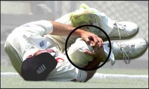 Jones rolls around in agony as he ruptures the anterior cruciate ligament in his right knee