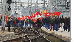 Workers block the Milan central station, Italy, protesting against job losses