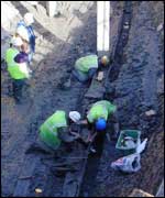 Workers examining the keel