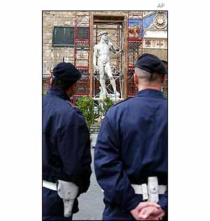 Police look at a copy of David by Michelangelo 