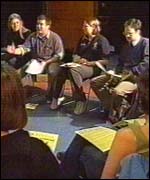 Students attend a meeting to discuss proposed fees 