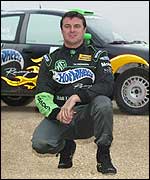 Mark Blundell poses with his MG rally car