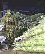Man in camouflage gear with Christmas trees