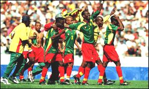 Cameroon's players celebrate after beating Spain in the final 