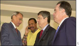 General Secretary of the Organisation of American States, OAS, Cesar Gaviria, right, shakes hands with Senator Alejandro Armas, an opponent of President Hugo Chavez