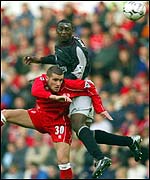 Middlesbrough's Stuart Parnaby and Emile Heskey of Liverpool compete in the air at The Riverside