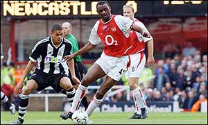 Arsenal's Patrick Vieira shields the ball from Newcastle's Jermaine Jenas during the first half