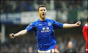 Everton's Tomasz Radzinski enjoys scoring his side's only goal against Charlton