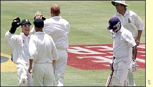 Hasantha Fernando walks back to the dressing room