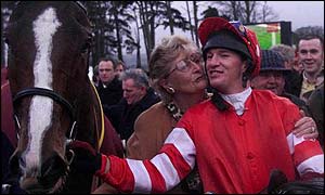 Florida Pearl's owner Violet O'Leary expresses her gratitude to jockey Barry Geraghty after their victory in the 2000 Hennessy Gold Cup