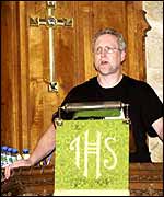 A T-shirt-clad Rev Chris Sterry prepares to deliver his 