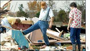 Residents look through the wreckage of their mobile homes in Tennessee