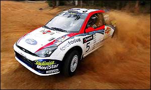 Colin McRae kicks up some dust during the Rally Australia