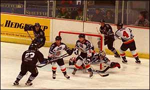 Manchester Storm (in black) on their way to victory in the 1999 Benson & Hedges Cup final