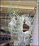 Pic of smashed window of Green Lanes cafe