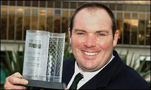 Wales rowing coach Damian Hammond shows his Sports Council for Wales Coach of the Year 2002 award