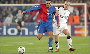 Danny Murphy tries to keep up with Basle's Antonio Esposito 