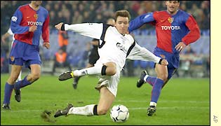 Vladimir Smicer scores his side's second to leave Basle reeling