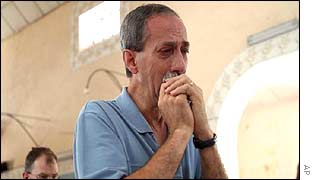 Brazilian Antonio Carlos Farias prays for his son, Marco, who remains missing from the Bali bombing