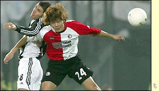 Aaron Hughes defends a high ball for Newcastle