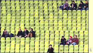 Bayern Munich's stadium is almost empty of home fans for their match with Lens