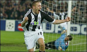 Craig Bellamy fires in his second goal in injury time to send Newcastle through